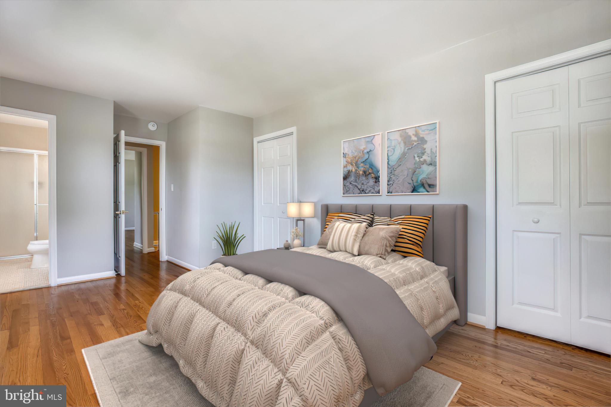 1593 Kimblewick Road Potomac, MD 20854 - Photo 21 of 45 a bedroom with a bed and wooden floor