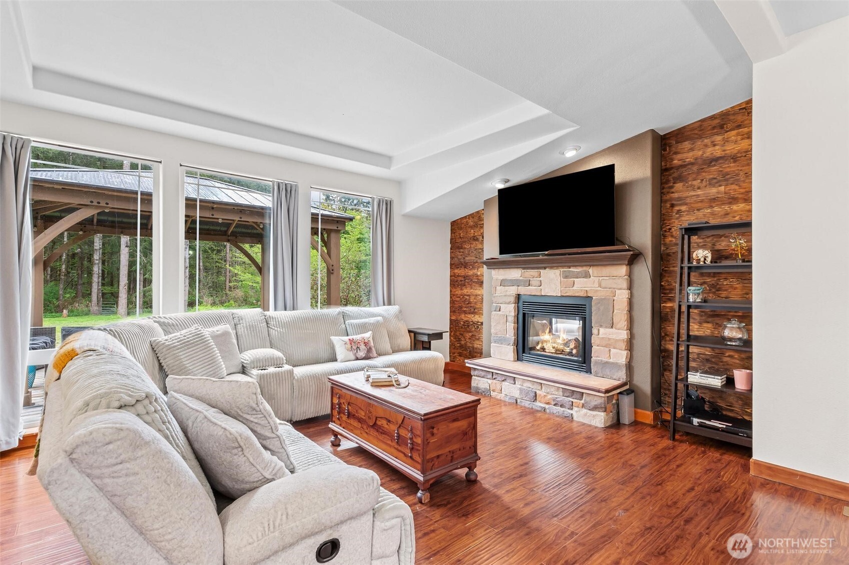 4915 Schwarzmiller Road Lake Stevens, WA 98258 - Photo 14 of 40 a living room with furniture a flat screen tv and a fireplace