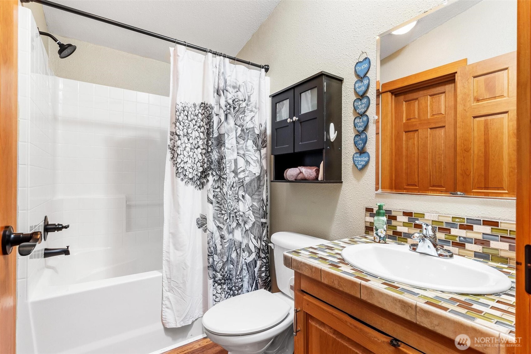 4915 Schwarzmiller Road Lake Stevens, WA 98258 - Photo 27 of 40 a bathroom with a sink toilet and shower