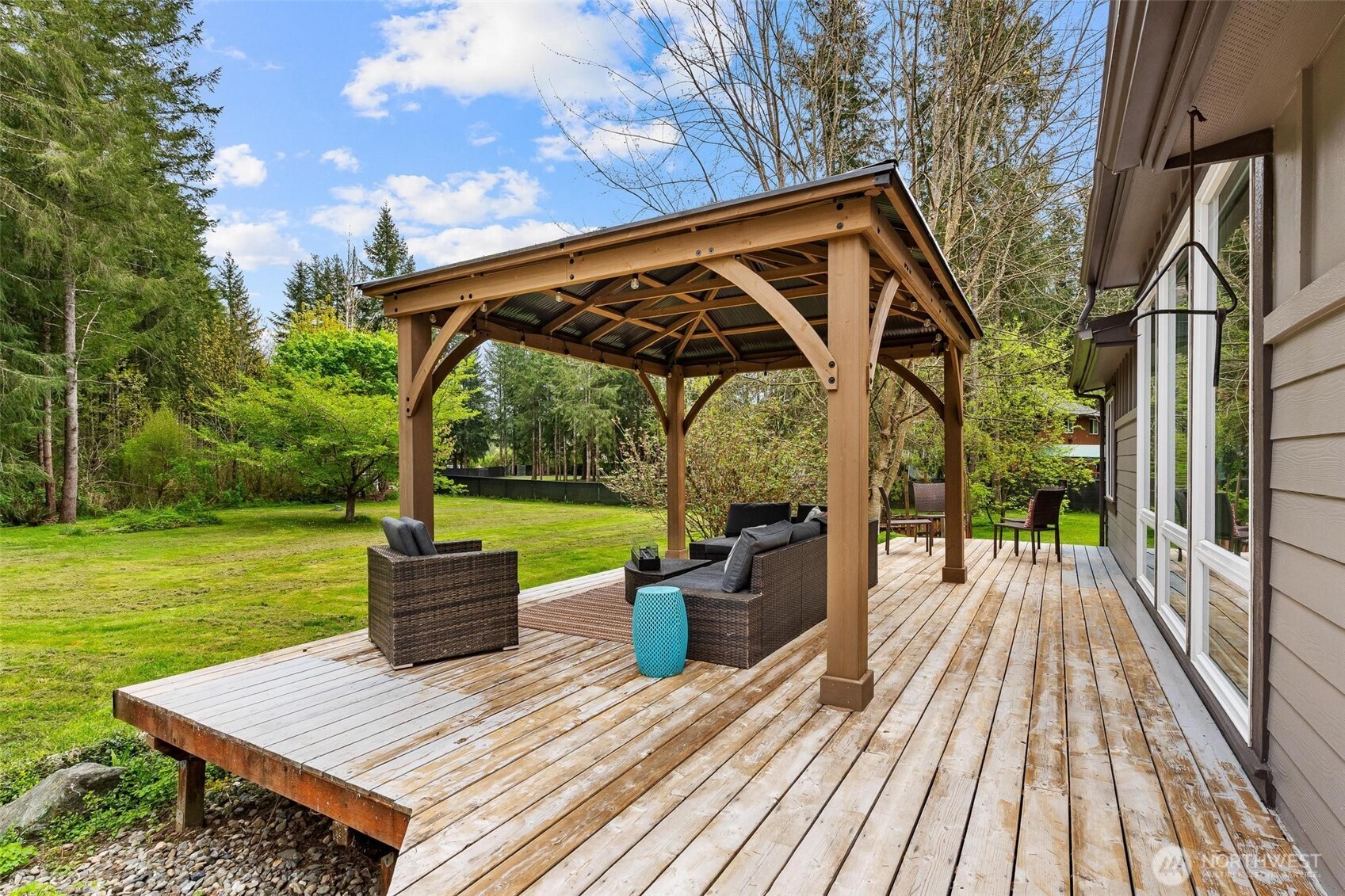 4915 Schwarzmiller Road Lake Stevens, WA 98258 - Photo 31 of 40 a view of a wooden deck and a yard