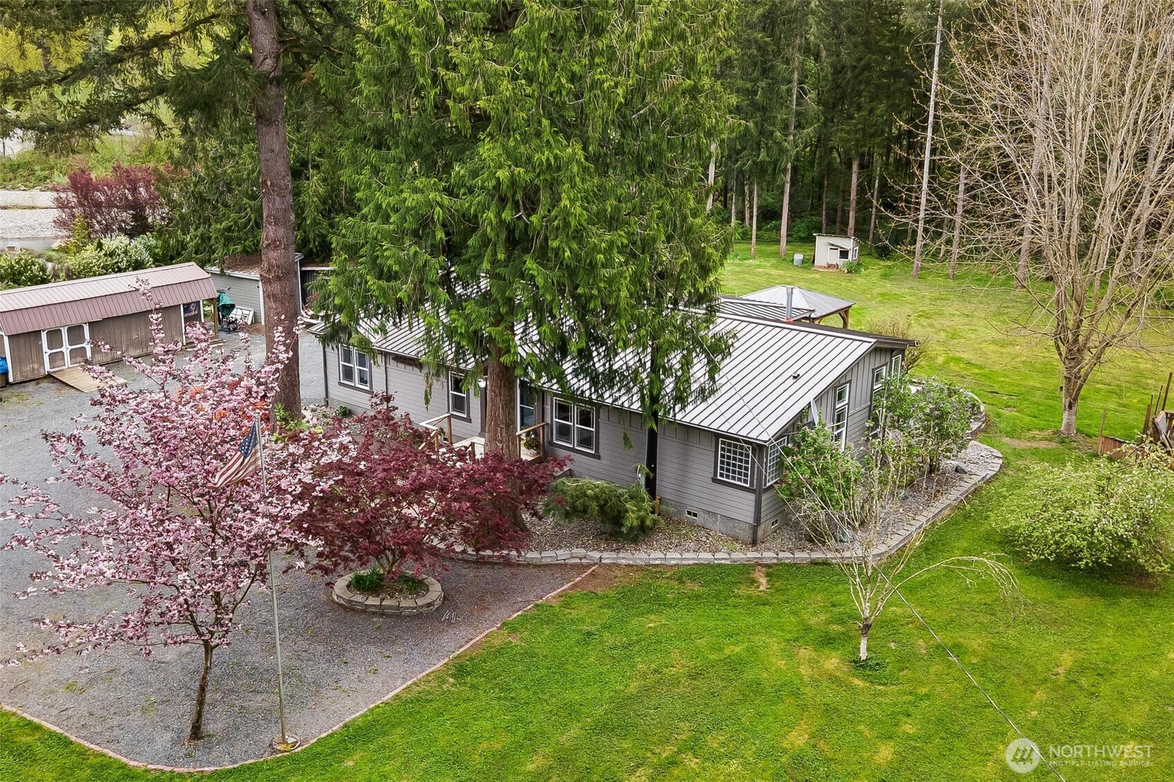4915 Schwarzmiller Road Lake Stevens, WA 98258 - Photo 35 of 40 a view of a house with pool and garden