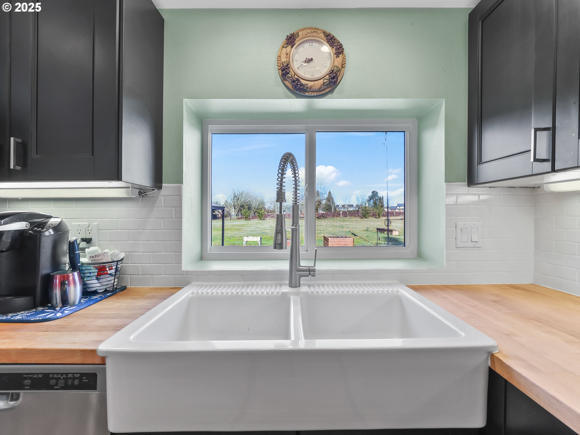 5714 Northwest 169th Street Ridgefield, WA 98642 - Photo 17 of 48 a view of a refrigerator a sink and a cabinets