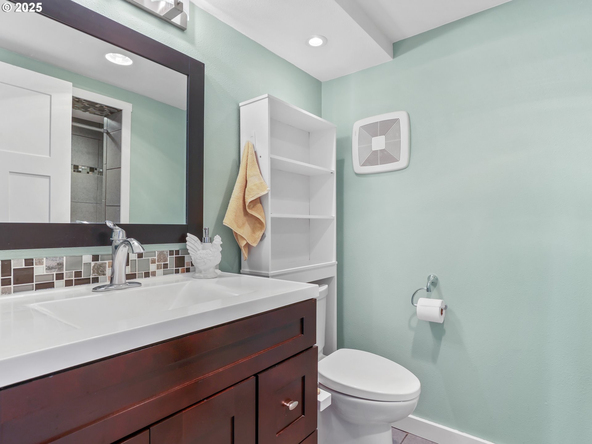 5714 Northwest 169th Street Ridgefield, WA 98642 - Photo 26 of 48 a bathroom with a sink a toilet a mirror and vanity