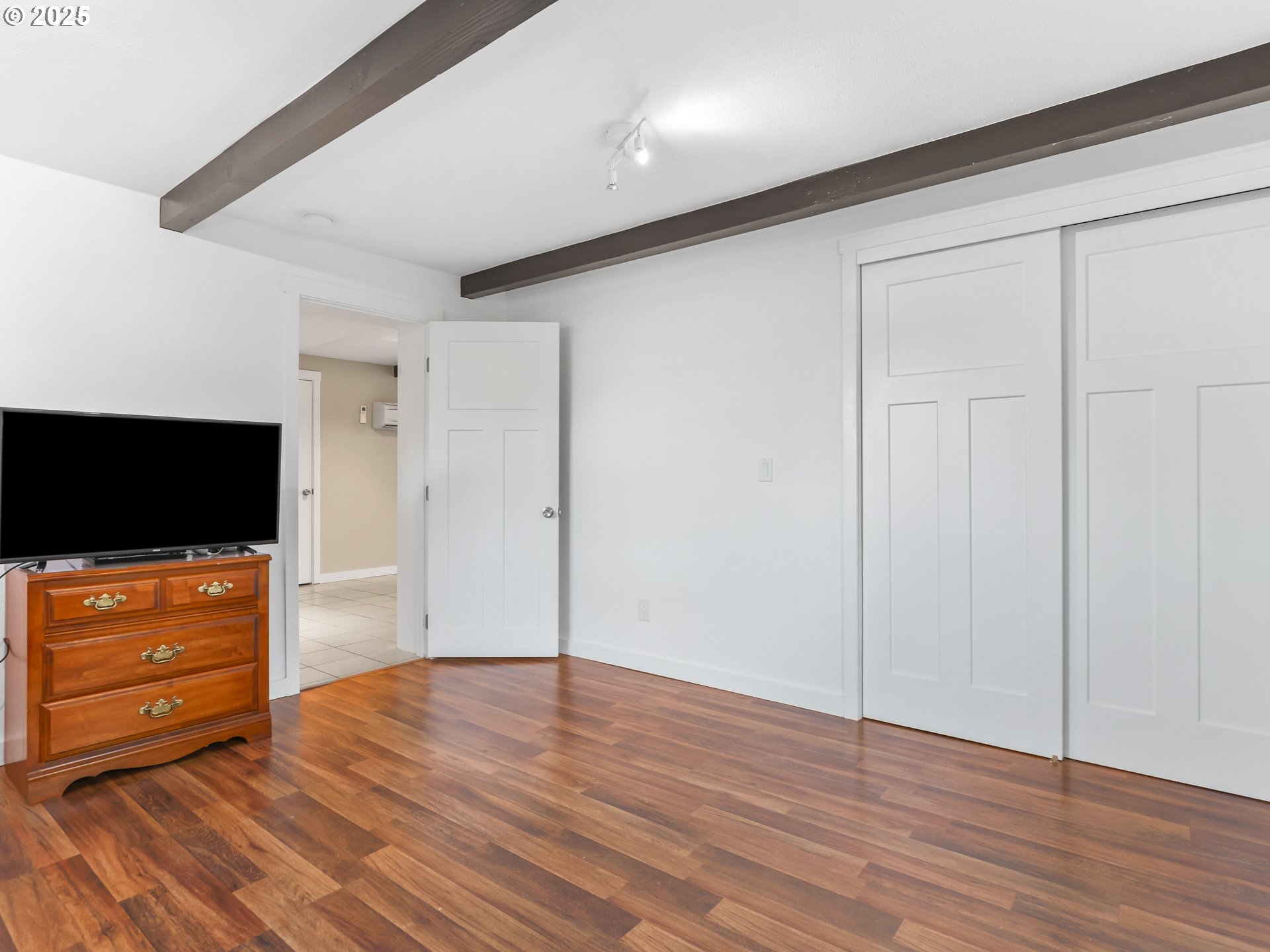 5714 Northwest 169th Street Ridgefield, WA 98642 - Photo 28 of 48 a view of an empty room with wooden floor and a window
