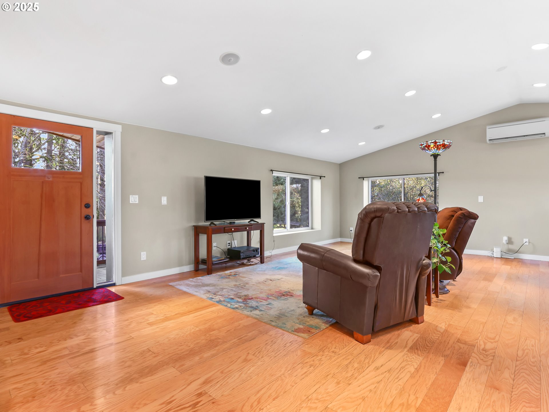 5714 Northwest 169th Street Ridgefield, WA 98642 - Photo 7 of 48 a living room with furniture and a flat screen tv