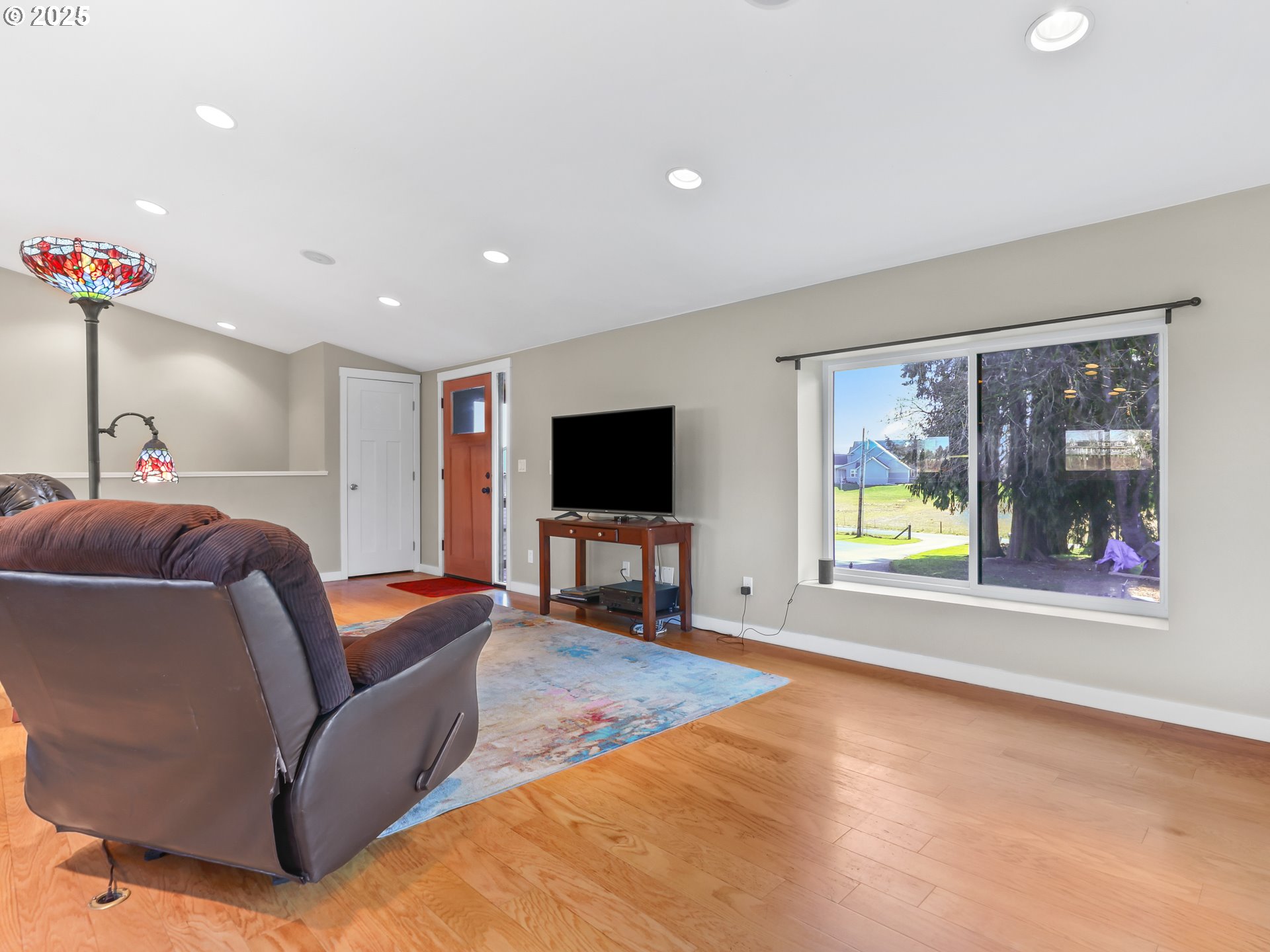 5714 Northwest 169th Street Ridgefield, WA 98642 - Photo 9 of 48 a living room with furniture and a flat screen tv