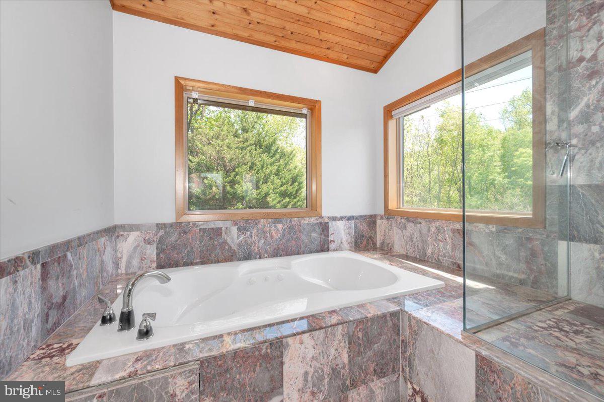 11127 Dublin Road Woodsboro, MD 21798 - Photo 47 of 62 a white bath tub sitting in a bathroom next to a window