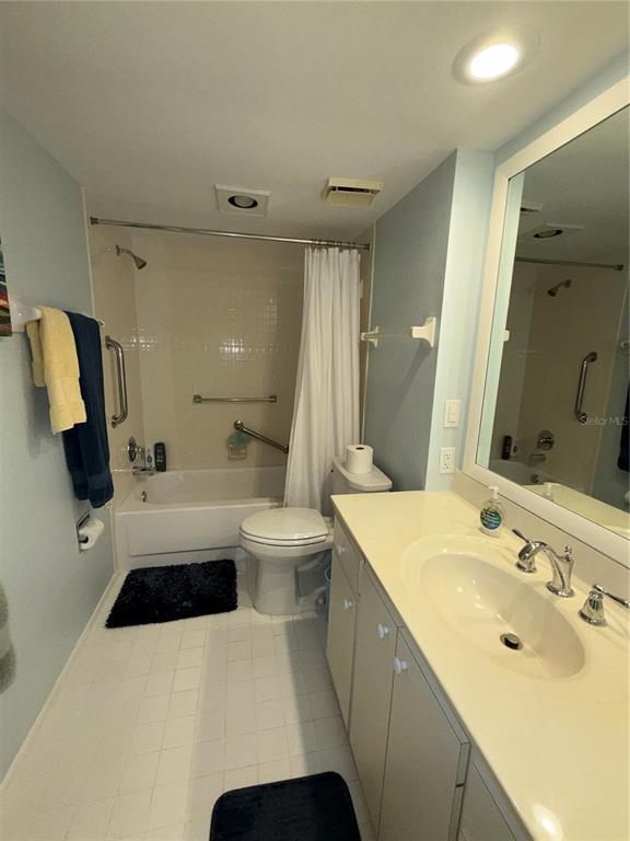 3240 Gulf Of Mexico Drive, Unit B402 Longboat Key, FL 34228 - Photo 9 of 15 a bathroom with a sink a toilet and a mirror