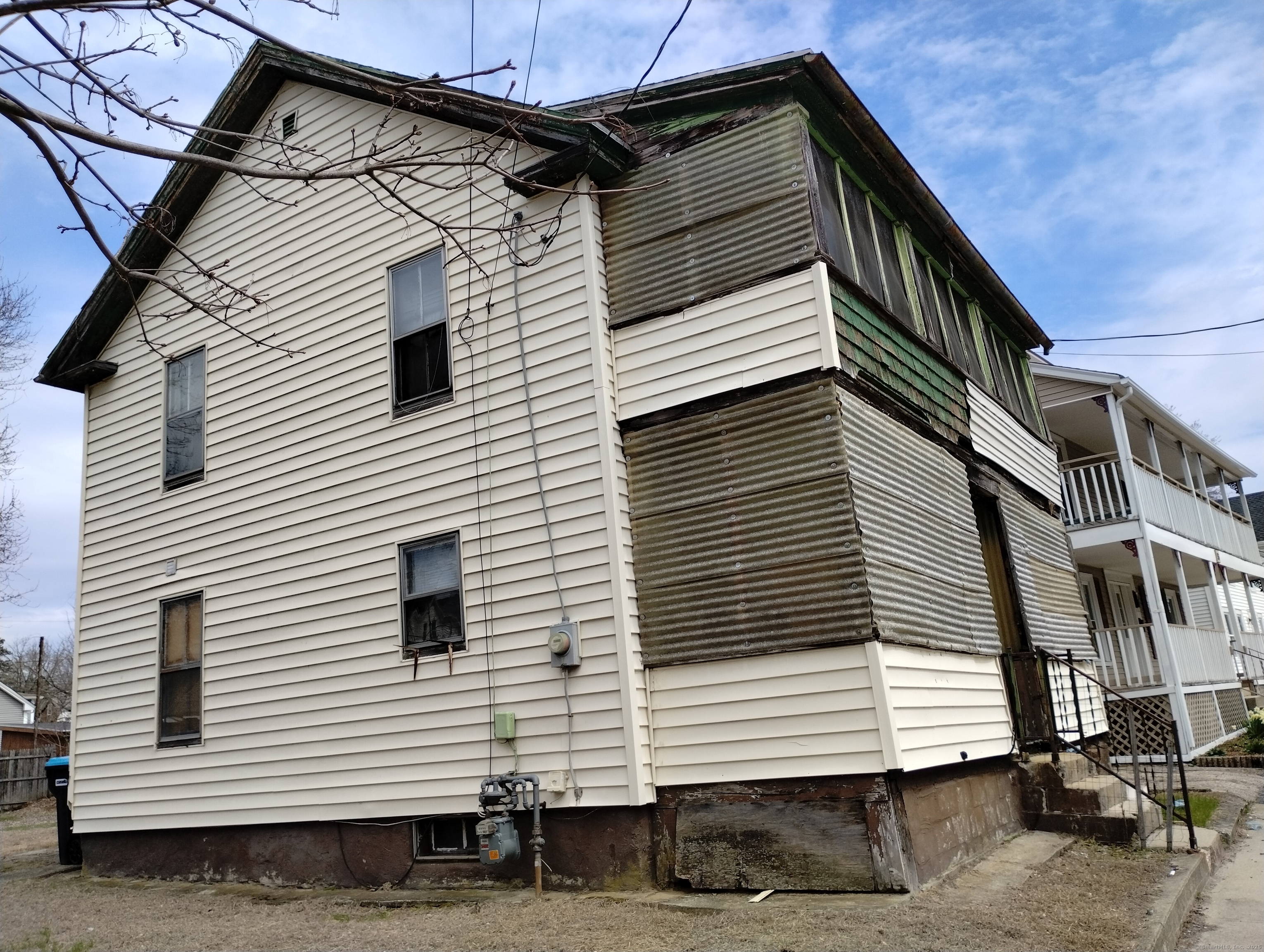 a view of a white house with a white door