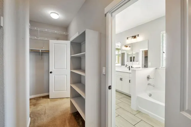 a bathroom with a bathtub and shower