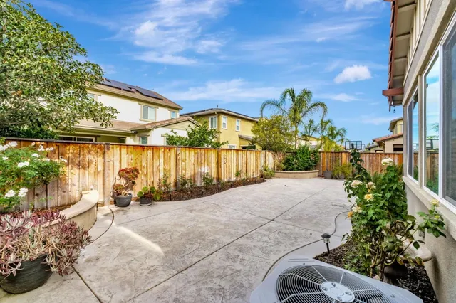 a view of a pathway with a wrought fence