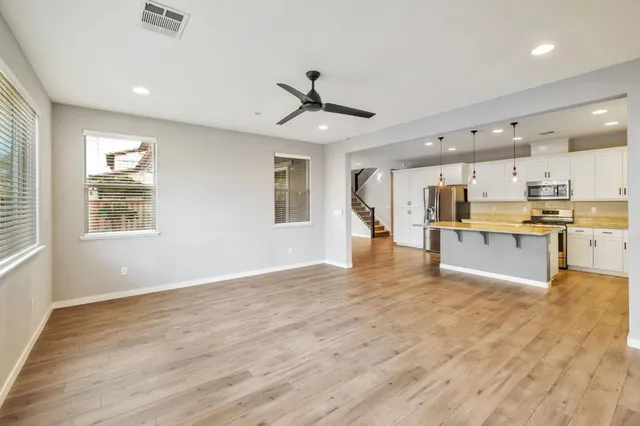 a view of kitchen with wooden floor and window
