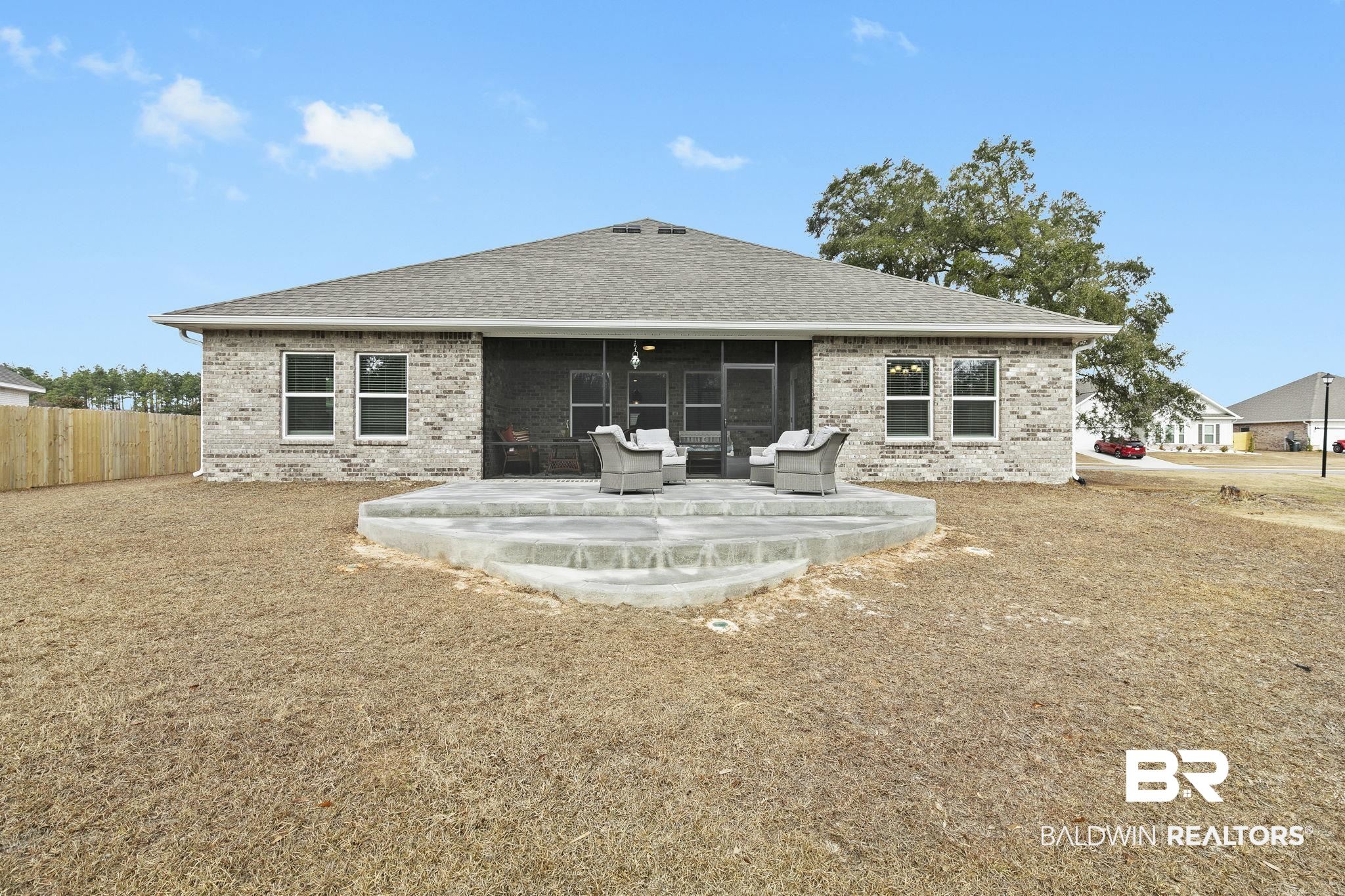 1141 Pencarro Boulevard Foley, AL 36535 - Photo 49 of 70 Back of house featuring a sunroom and a patio