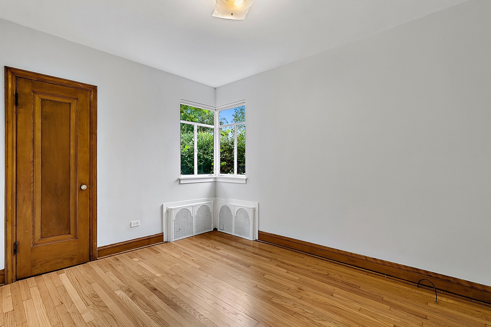 595 East Parkway Road Riverside, IL 60546 - Photo 13 of 35 a view of empty room with wooden floor and fan