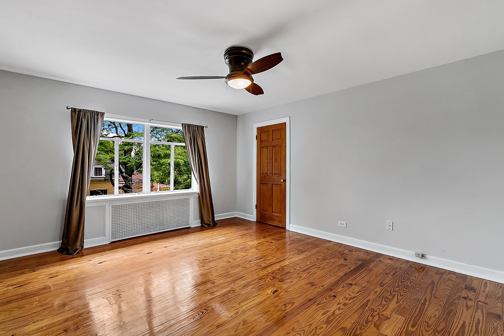 595 East Parkway Road Riverside, IL 60546 - Photo 17 of 35 wooden floor in an empty room with a window