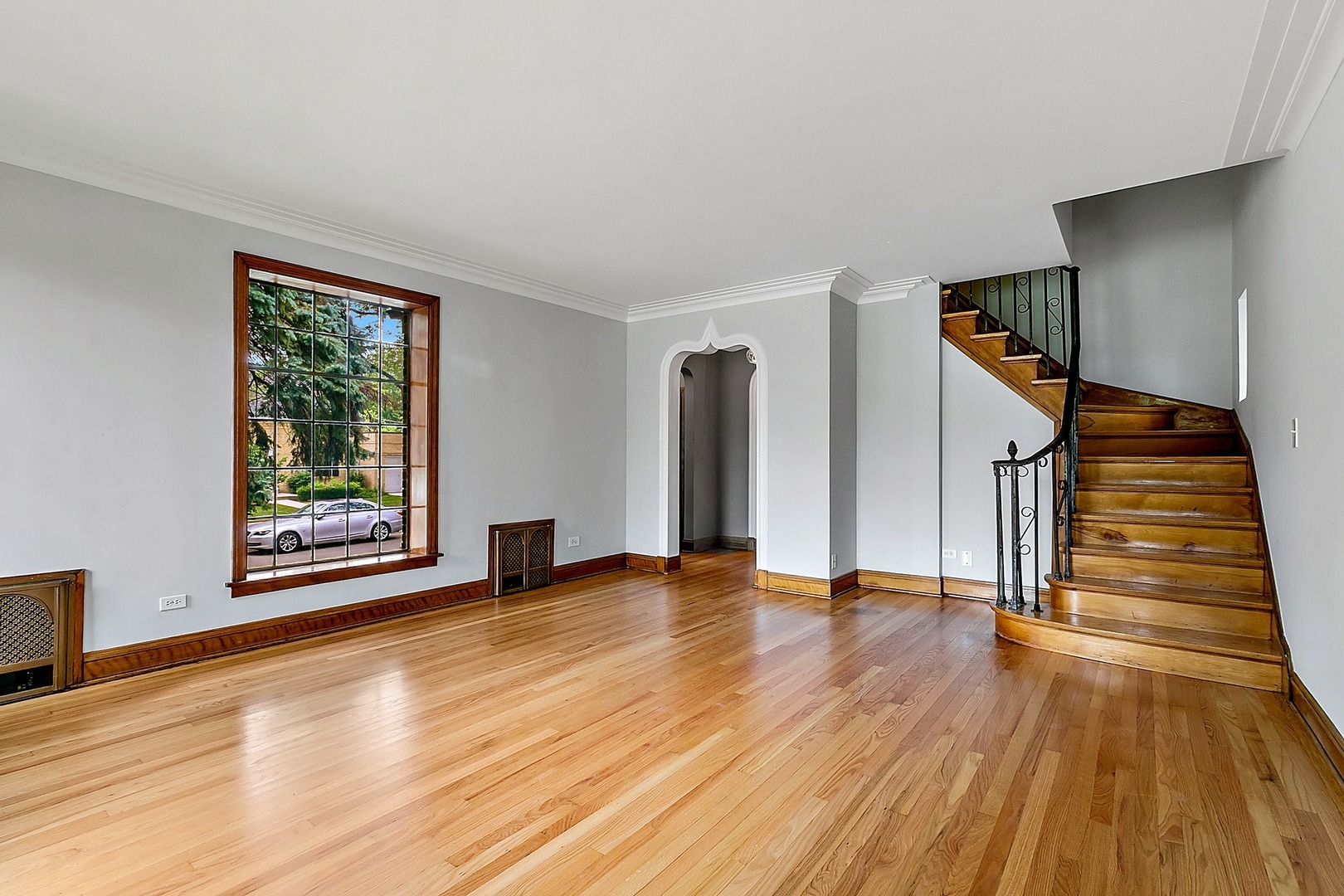 595 East Parkway Road Riverside, IL 60546 - Photo 3 of 35 a view of an empty room with wooden floor and stairs