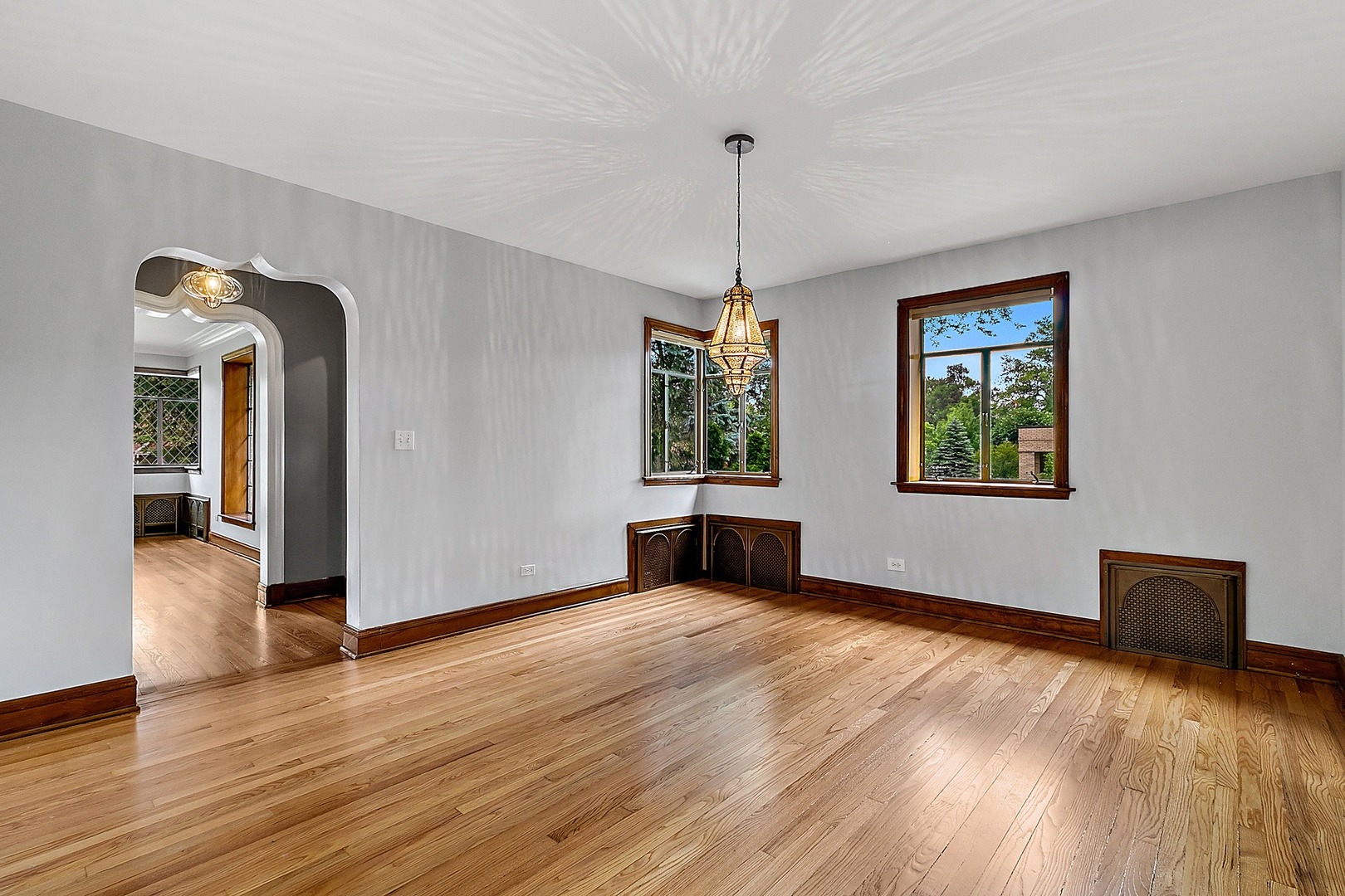 595 East Parkway Road Riverside, IL 60546 - Photo 6 of 35 a view of an empty room with window and wooden floor