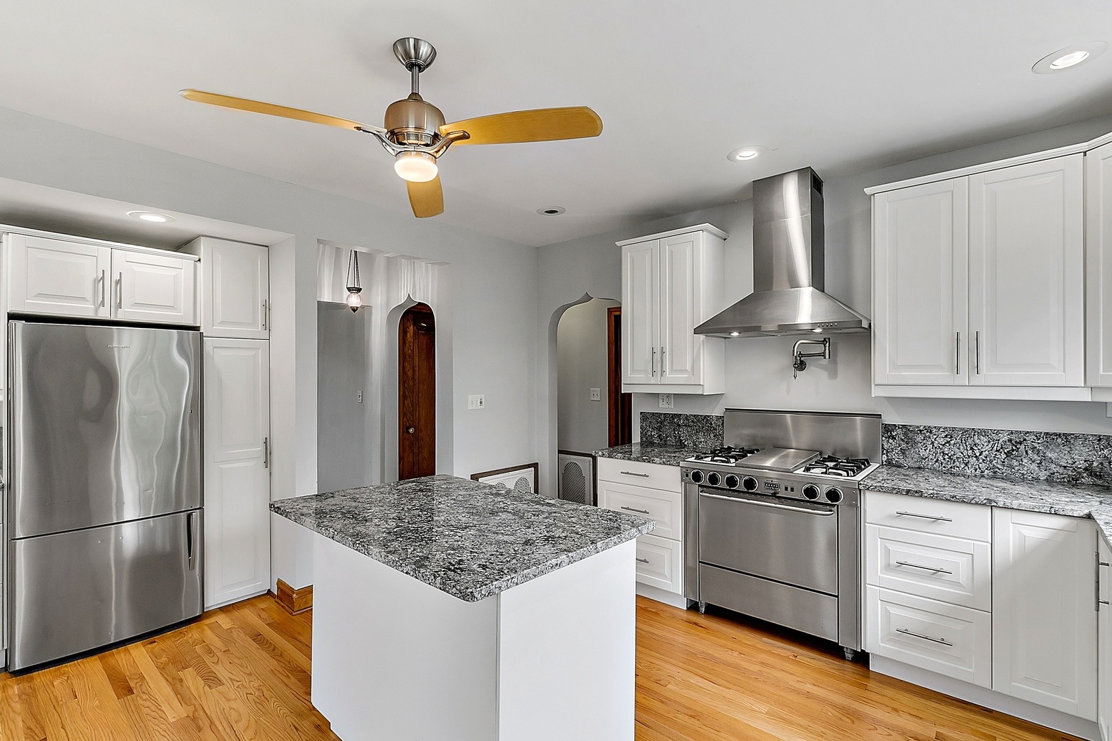 595 East Parkway Road Riverside, IL 60546 - Photo 9 of 35 a kitchen with stainless steel appliances granite countertop a sink stove and refrigerator