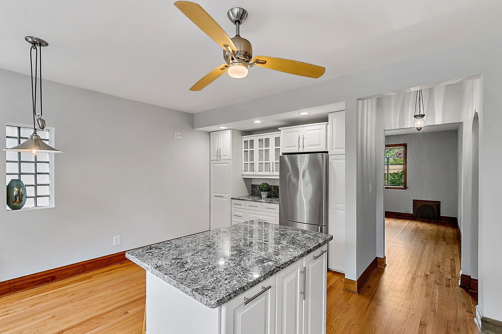 595 East Parkway Road Riverside, IL 60546 - Photo 10 of 35 a kitchen with stainless steel appliances granite countertop a sink a refrigerator and a stove