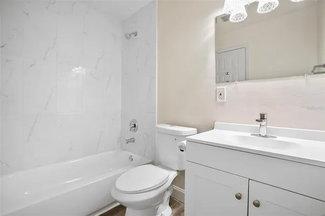 a bathroom with a sink a toilet and a bathtub