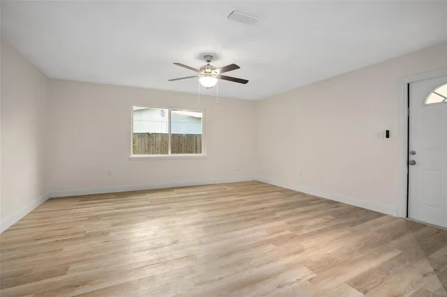 a view of an empty room with a window