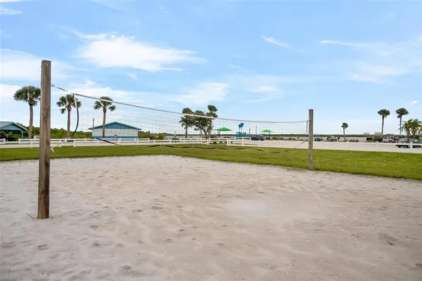 a view of a swimming pool and a yard