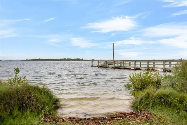 a view of a lake with a yard