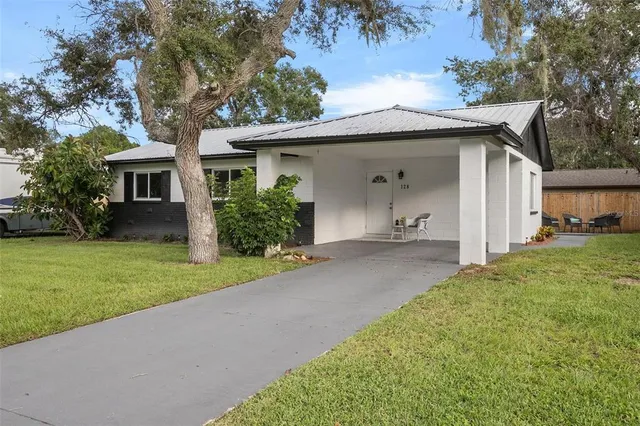 front view of a house with a yard