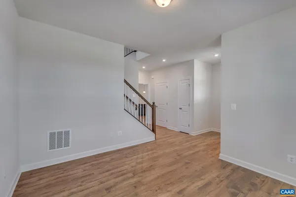 a view of an entryway with wooden floor