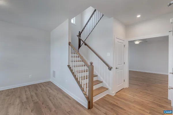 a view of entryway with wooden floor