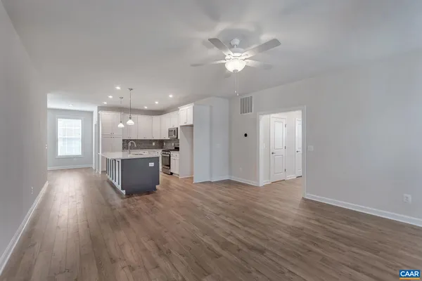 a view of kitchen with wooden floor and window