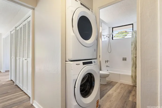 a view of a hallway with washer and dryer