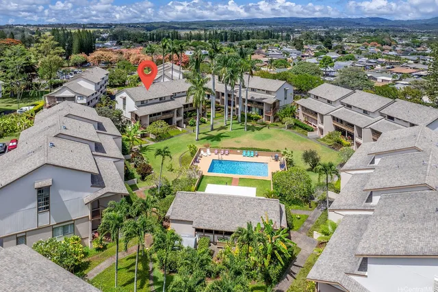 an aerial view of a house with a garden