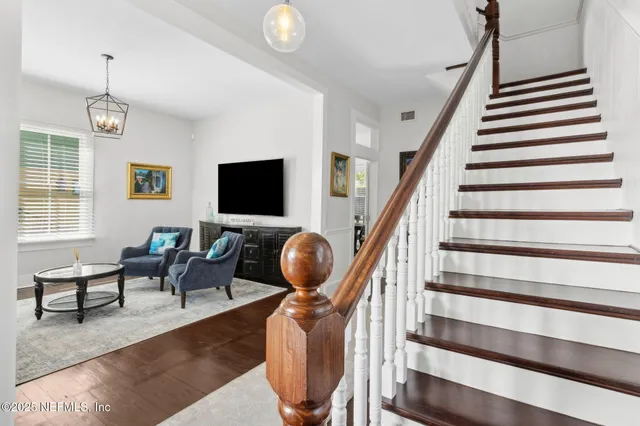 a view of an entryway with wooden floor