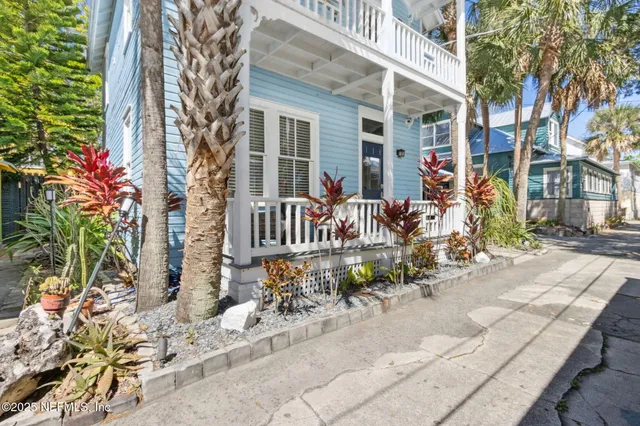 a spacious bedroom with a bed and a fireplace