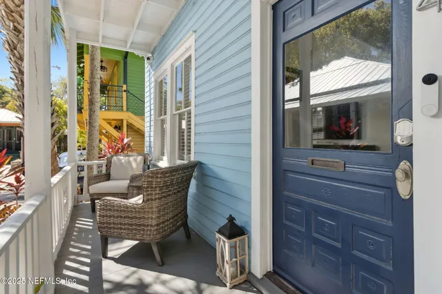 a kitchen with stainless steel appliances white cabinets and wooden floor