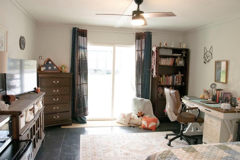 298 Redbud A Mexia, TX 76667 - Photo 24 of 40 a bedroom with furniture a window and a flat screen tv
