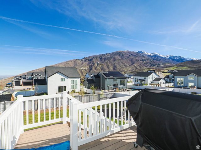 2487 Canyon Wild Road, Unit 413 Draper, UT 84020 - Photo 58 of 75 Deck featuring a residential view, a mountain view, a fenced backyard, and area for grilling