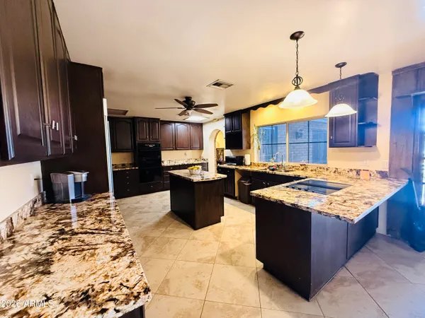 a kitchen view of living room and sink