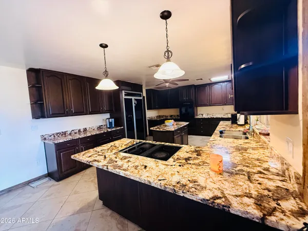 a kitchen with stainless steel appliances granite countertop a stove and a sink