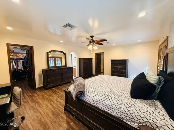 a view of a bedroom from the hallway