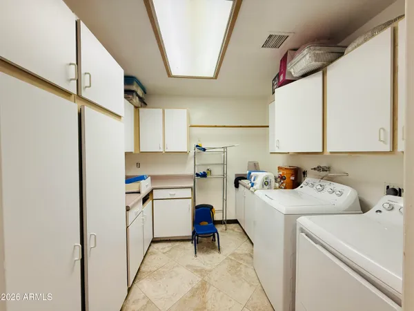 a kitchen with a sink a microwave and refrigerator