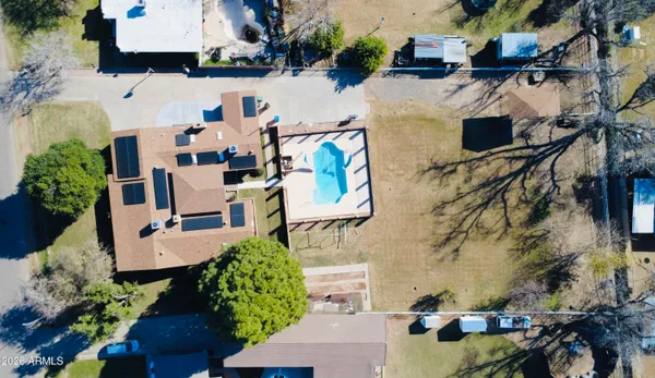 a view of a swimming pool with an outdoor seating