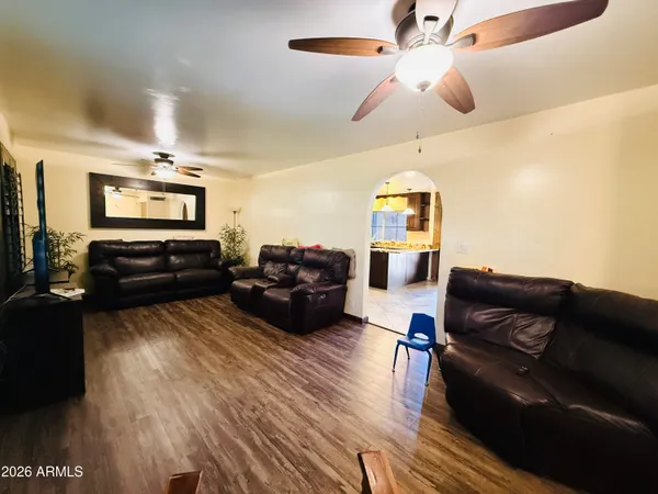 a view of a dining room with furniture and wooden floor