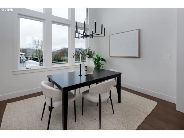 a bed room with a bed and a painting on the wall