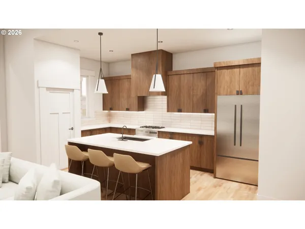 a kitchen with a sink a counter top space and stainless steel appliances