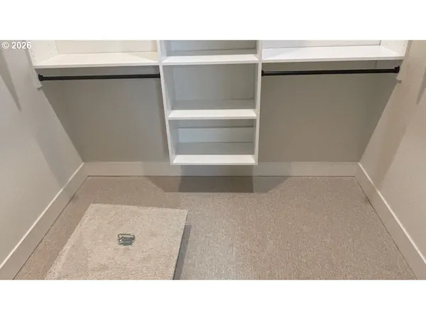 a bathroom with double sink and a mirror