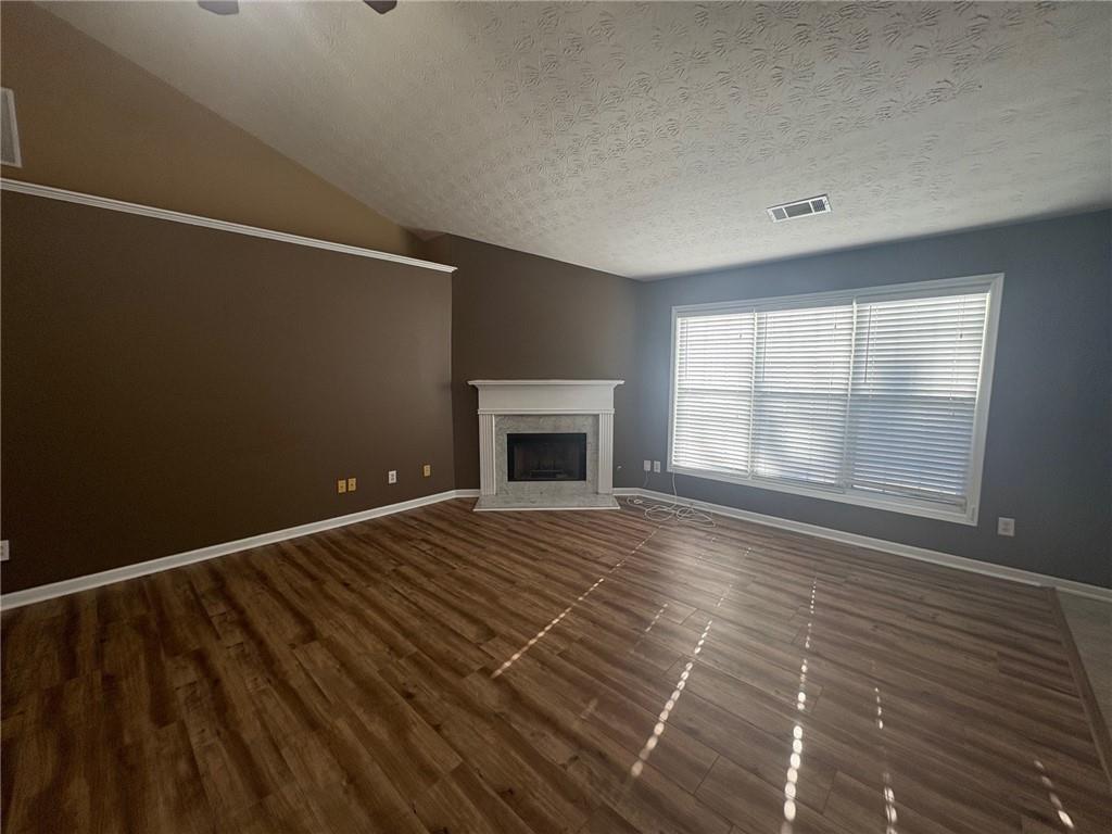 3452 Morning Top Place Suwanee, GA 30024 - Photo 13 of 33 a view of an empty room with a window and fireplace