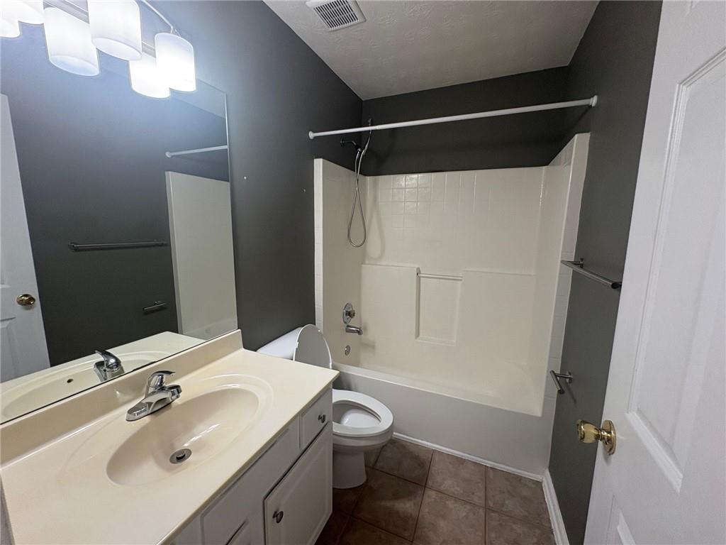 3452 Morning Top Place Suwanee, GA 30024 - Photo 17 of 33 a bathroom with a sink toilet and shower