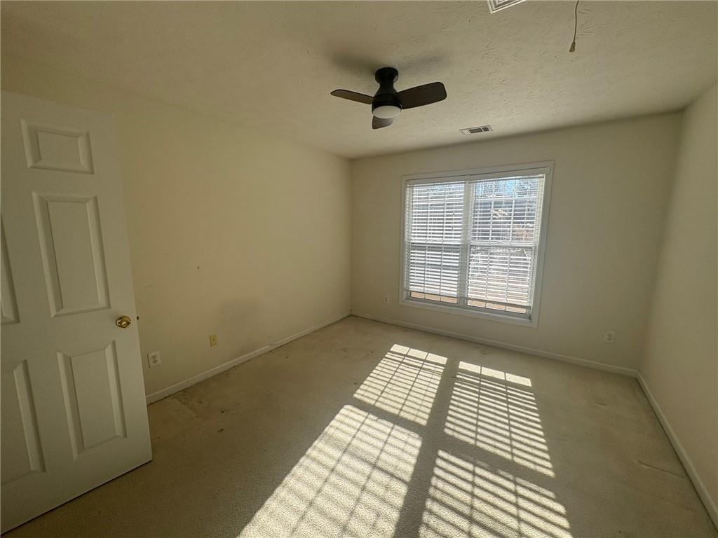 3452 Morning Top Place Suwanee, GA 30024 - Photo 18 of 33 a view of an empty room and a window